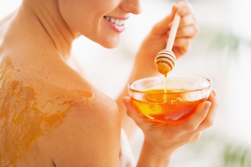 woman using Manuka honey